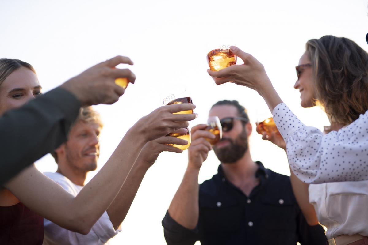 People enjoying Brugal 1888 rum at cocktail party
