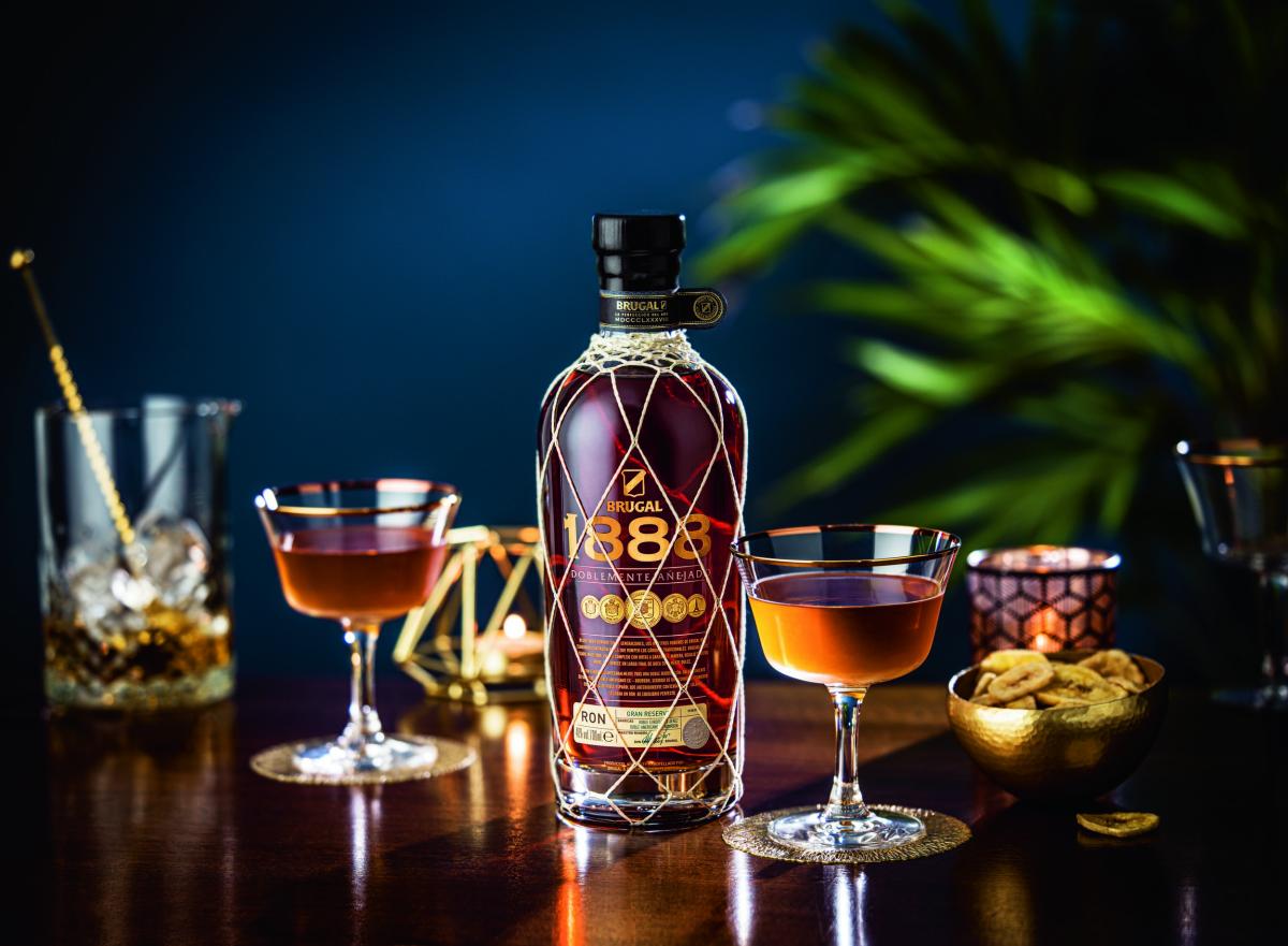 Brugal 1888 bottle and Manhattan cocktails on table