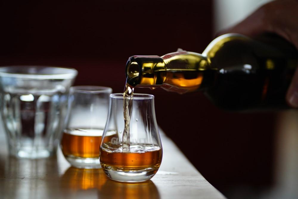 Pouring into glencairn whiskey glass