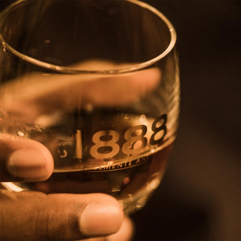 legs on glass of Brugal 1888 rum