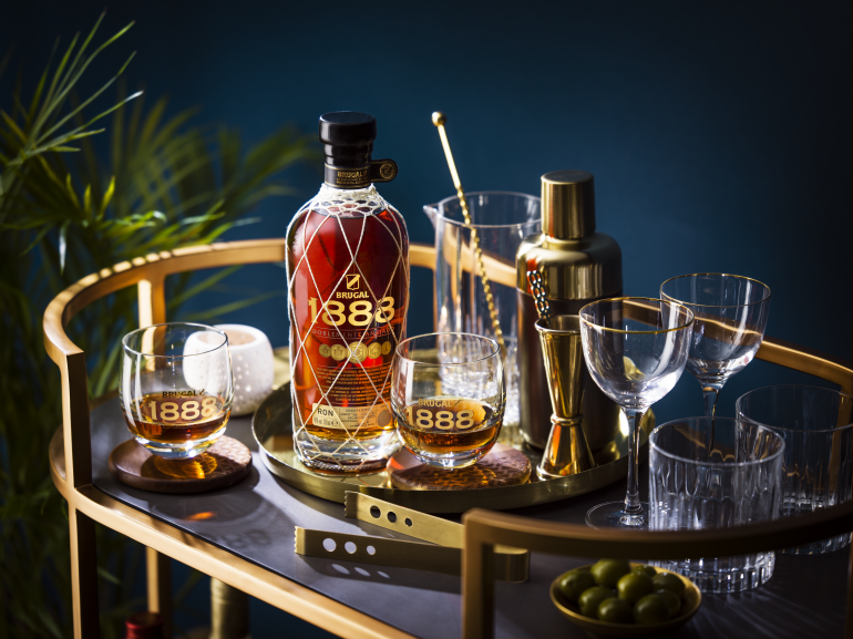 Brugal 1888 home bar cart with glasware and cocktail shaker
